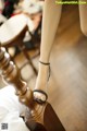 A close up of a woman's feet on a bed.