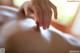 A woman getting a back massage at a spa.